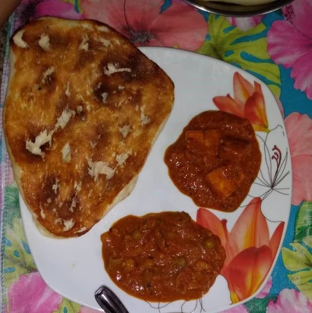 Paneer Tikka Masala served with Naan bread paneer tikka masala